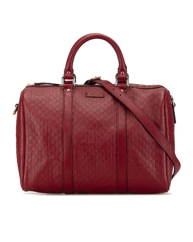 Embossed Leather Satchel with Detachable Strap and Interior Pockets